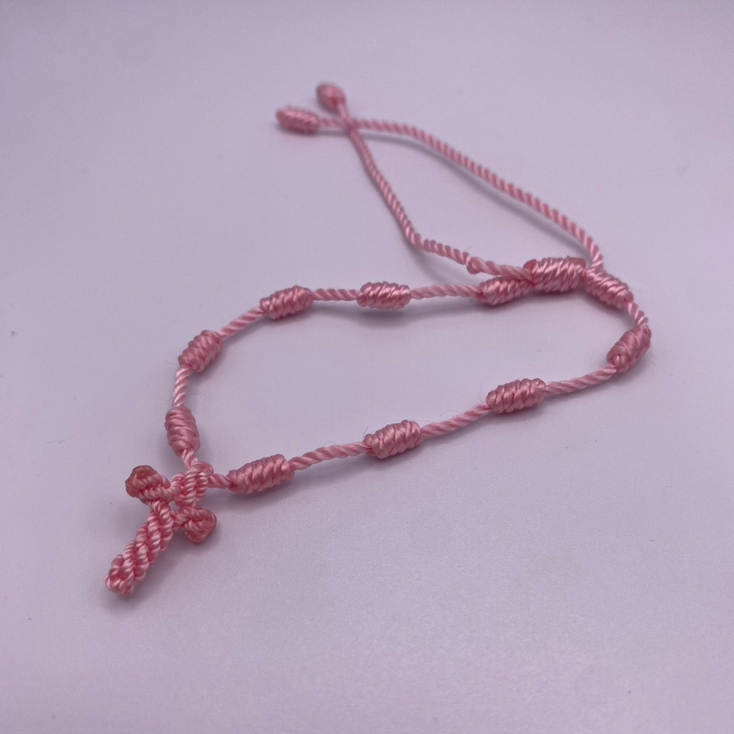 Brazalete con cruz rosa